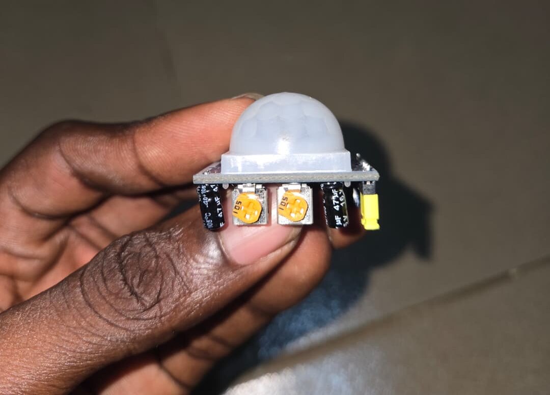 The PIR sensor with its two potentiometers, sensitivity and delay, both turned all the way up